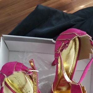 Pink and gold high heeled shoes